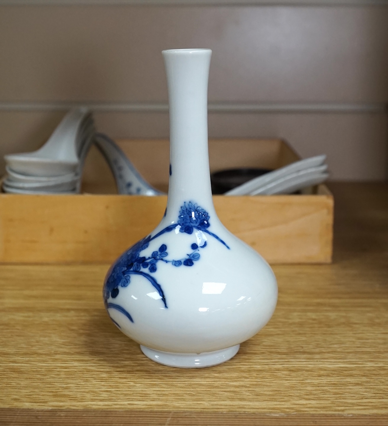 A small Chinese porcelain blue and white vase, Republic period, on a hardwood stand and various soup spoons, Guangxu/Republic period, vase 14cm high. Condition - good